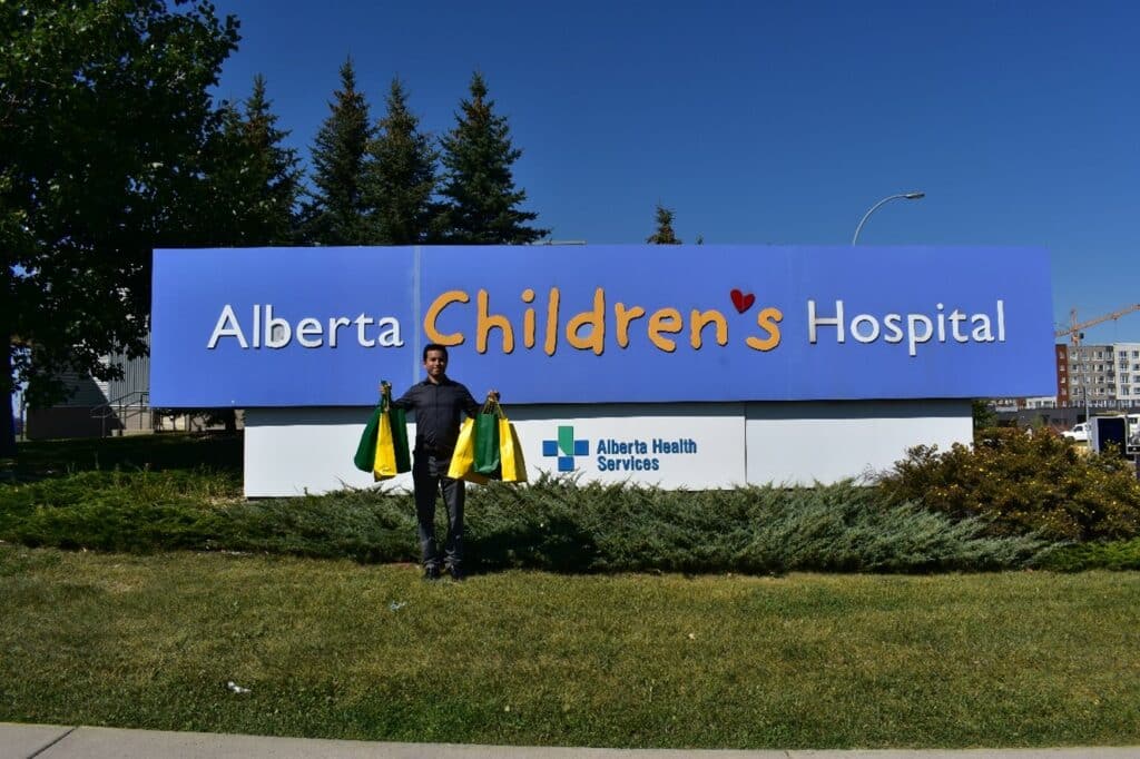 Pictured: Talent Acquisition Manager Kieran makes a donation in Calgary.